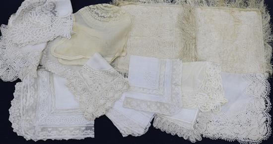 Various 19th century and later handmade lace trimmed hankies and a silk hankie sachet and baby bonnet